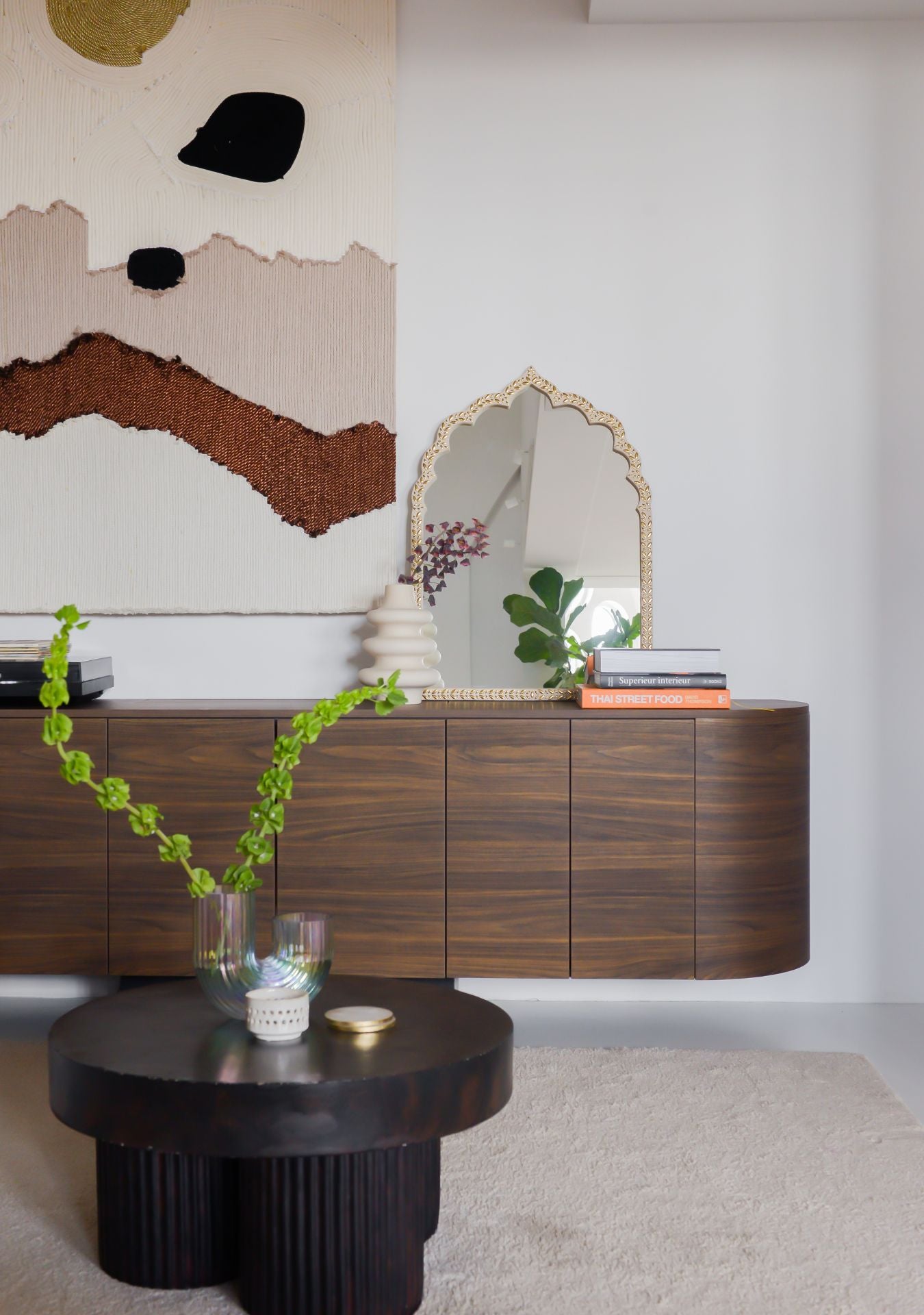 Handcrafted oriental mirror with golden mosaic frame styled on a wooden sideboard, paired with abstract wall art and modern decor – Pure Reflection.