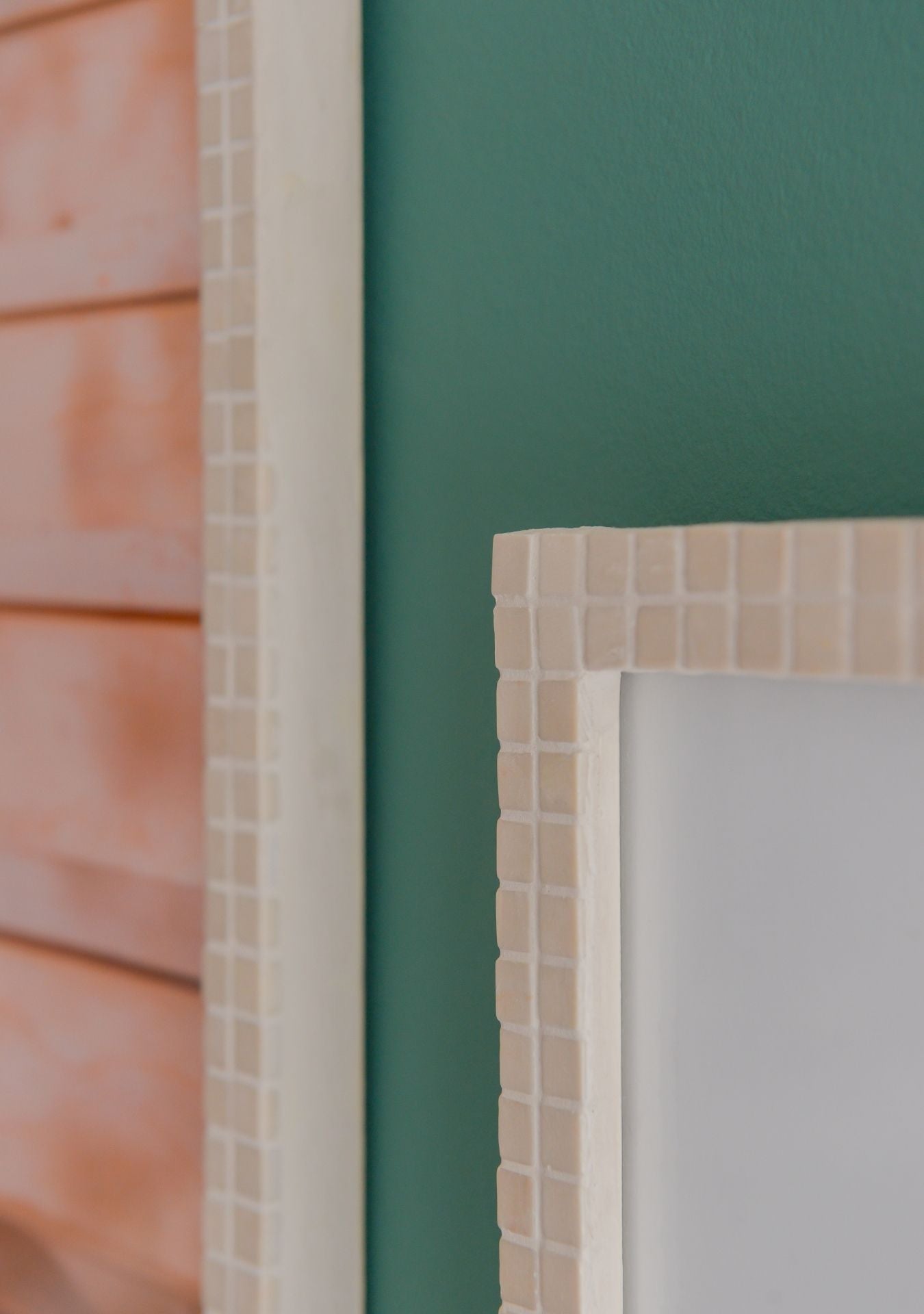 Close-up of beige mosaic photo frame edges and texture – Pure Reflection