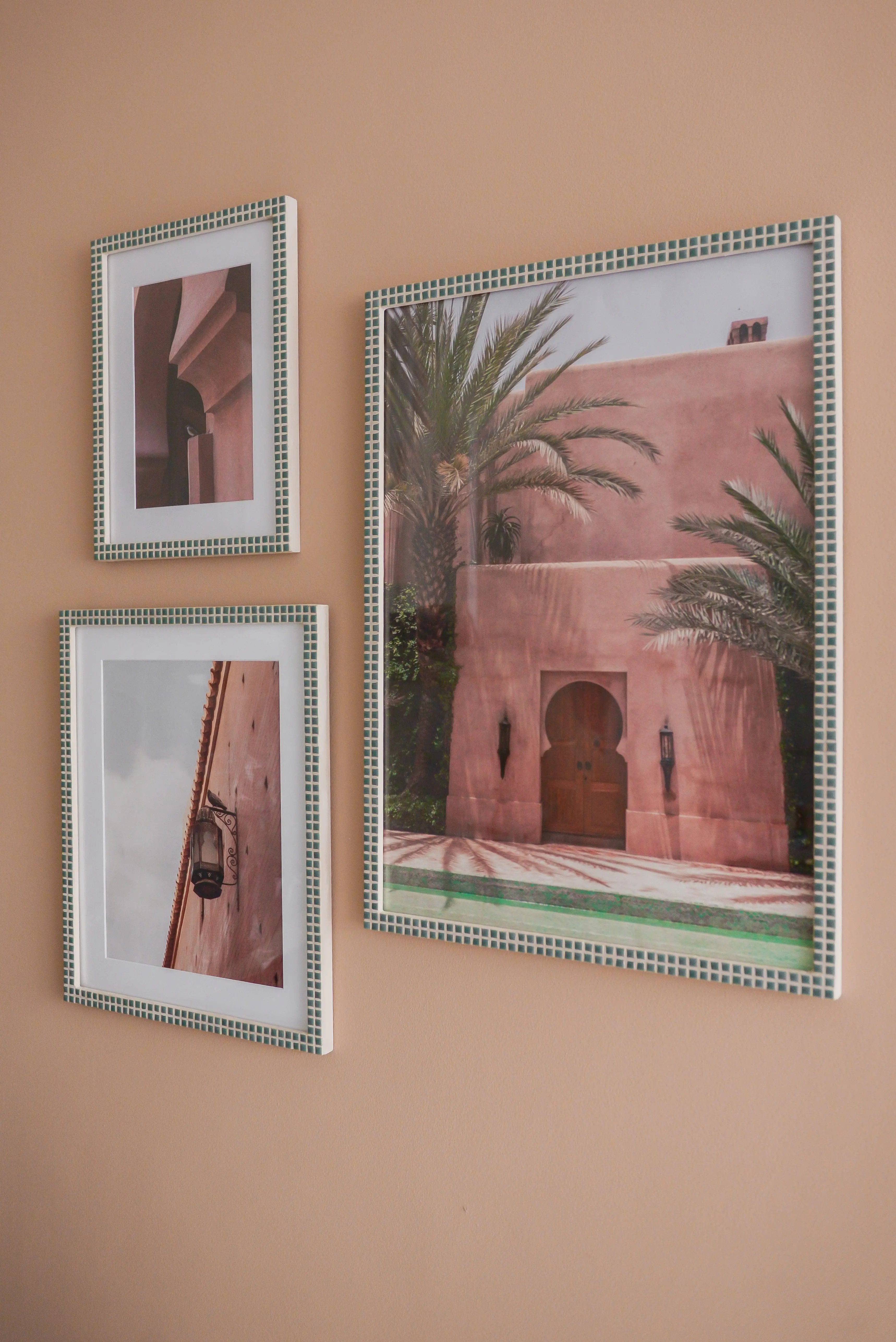 Handmade green mosaic photo frames displayed on warm beige wall – Pure Reflection