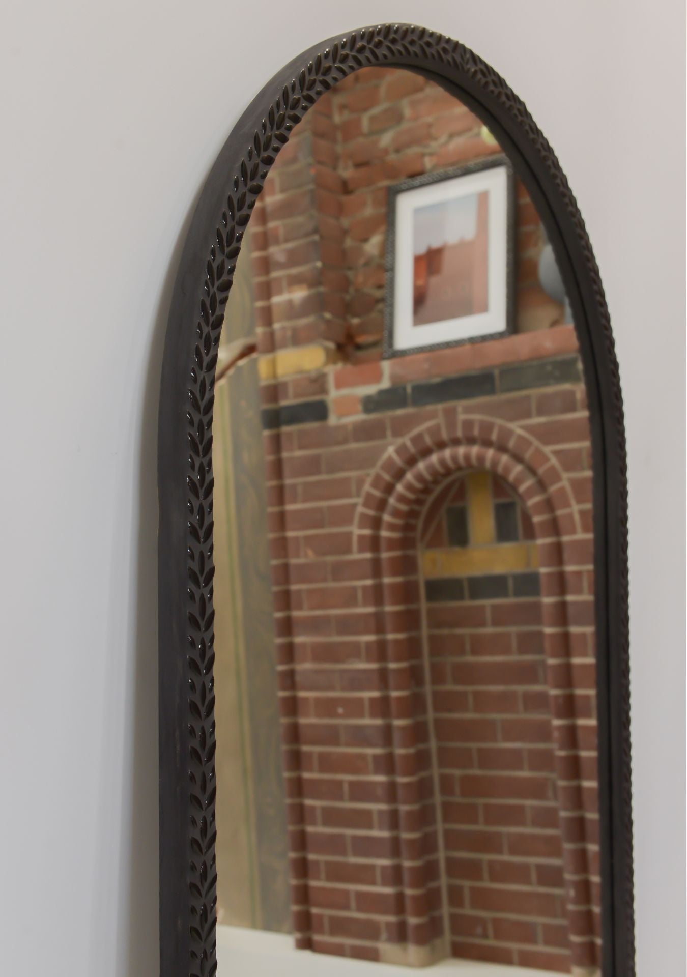 Pure Reflection designer mirror adding depth and sophistication to a contemporary room.