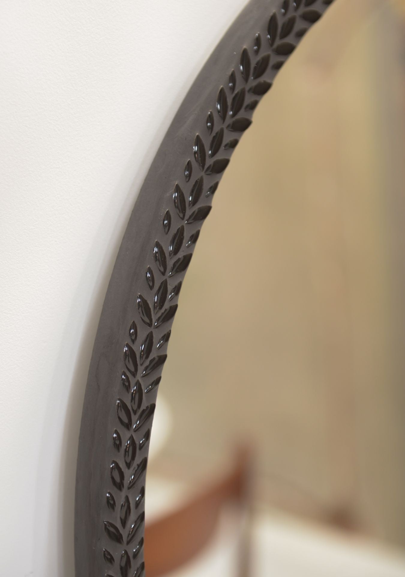 Detail of Pure Reflection Mirror Maraya Black showing artisan mosaic frame and reflection.