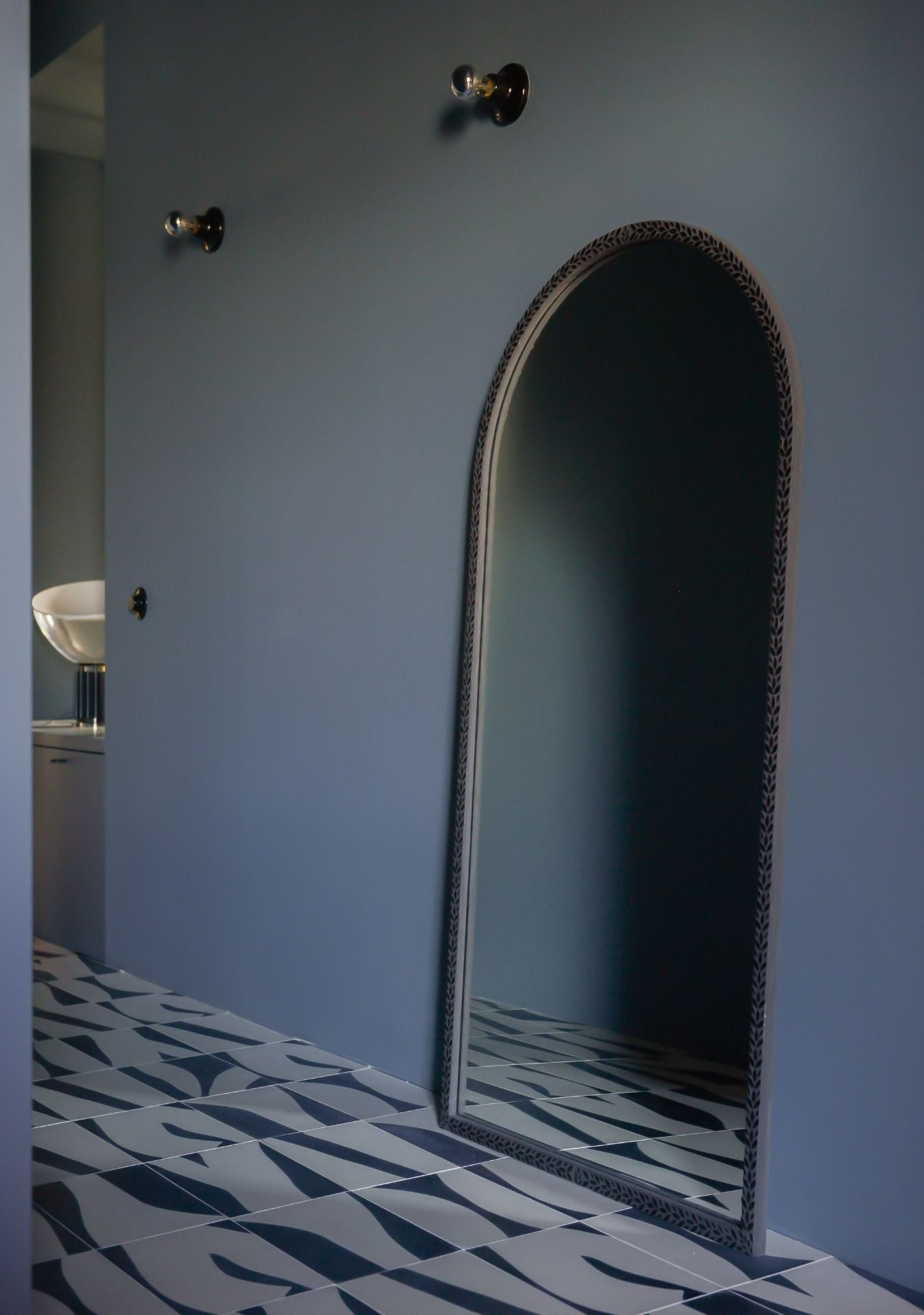 Pure Reflection designer mirror adding depth and sophistication to a contemporary hal.