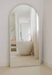 Mirror Lustro White styled in a serene white bathroom with natural light and soft tones.
