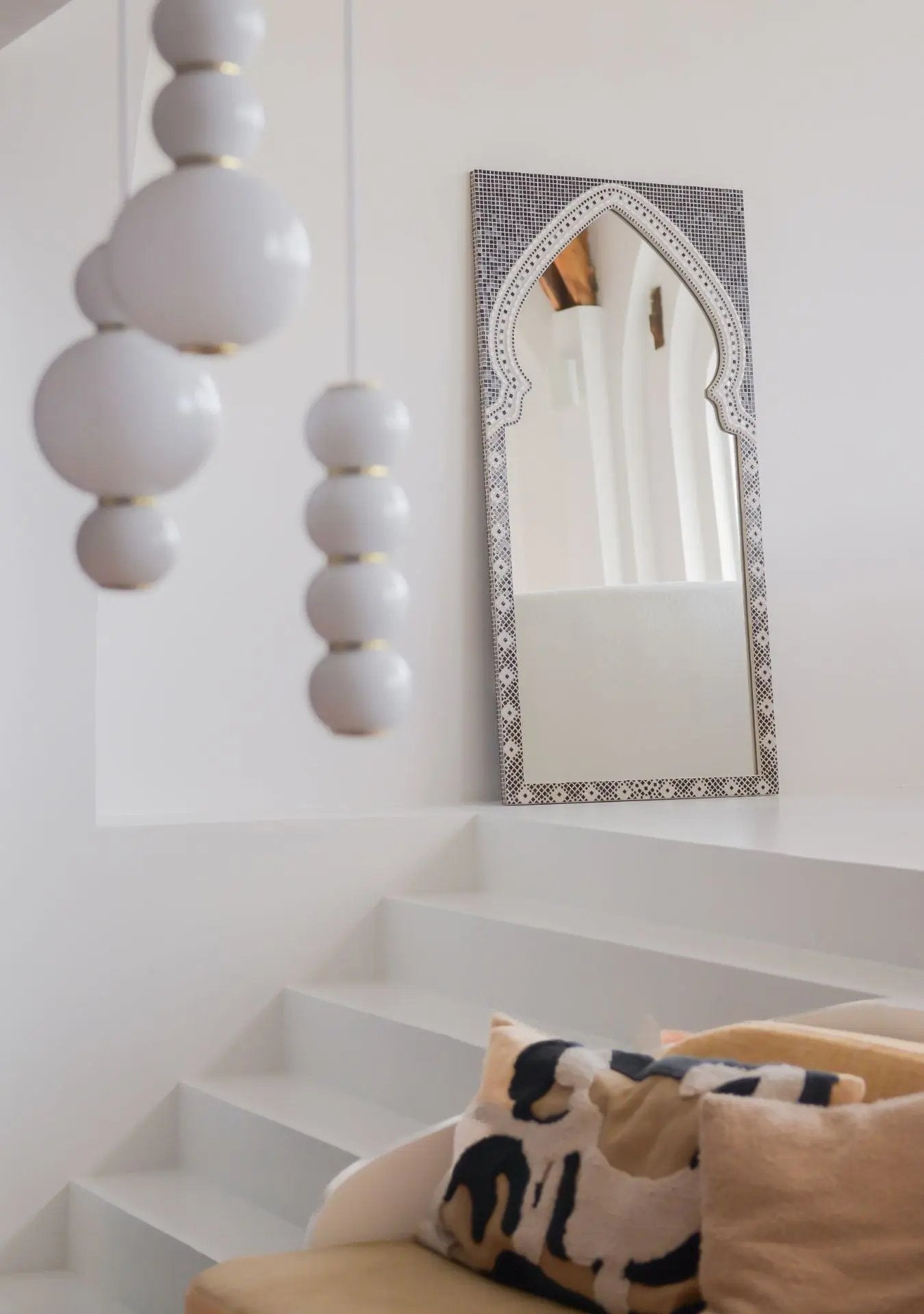Pure Reflection Mirror Maraya Black styled in a minimal white interior with natural light.