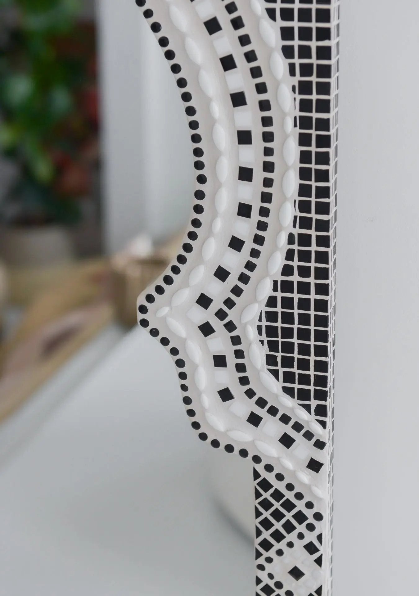 Close-up of mosaic craftsmanship and grout texture on the Mirror Maraya Black.