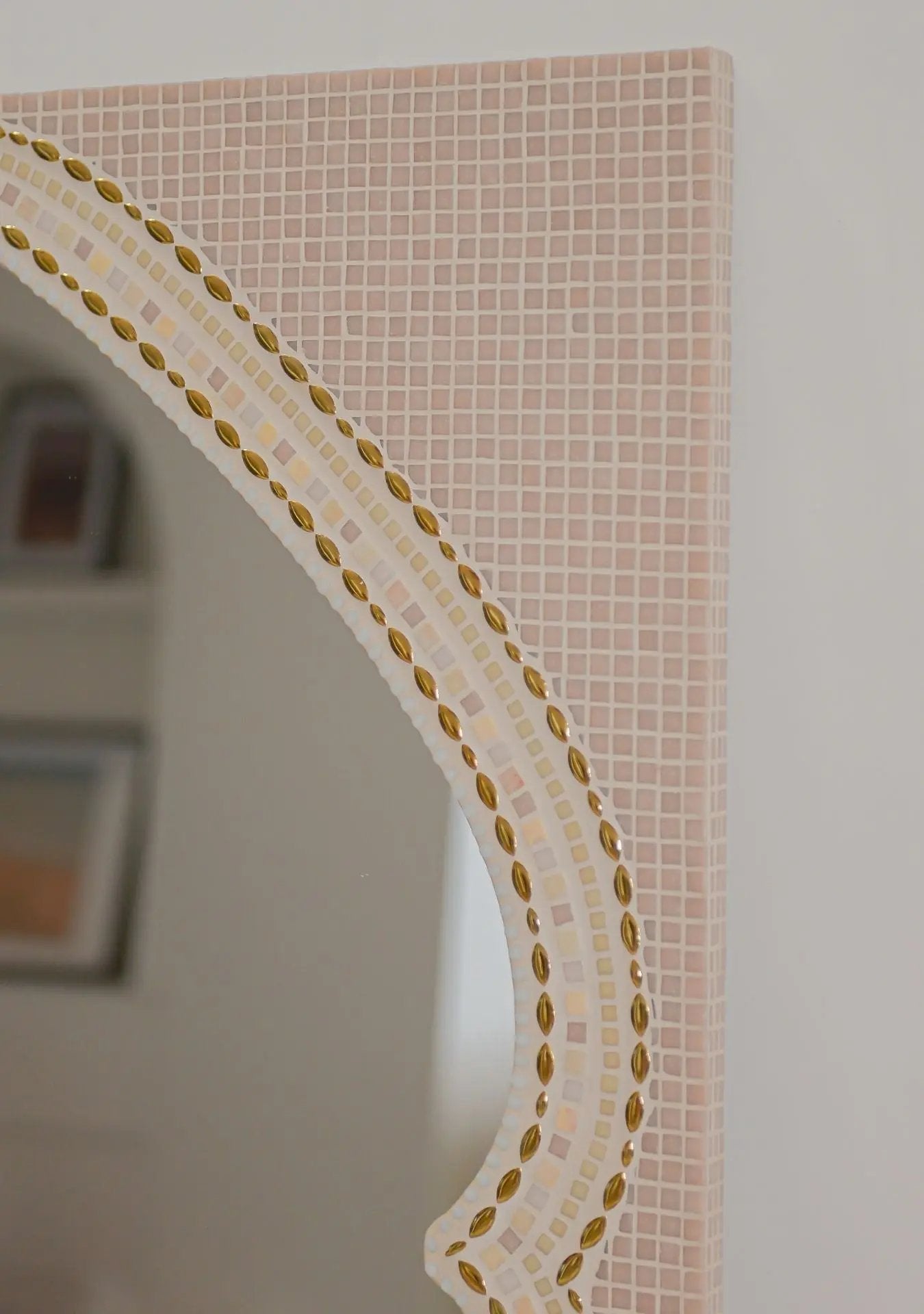 Close-up of pink mosaic stones details and artisan craftsmanship on the Maraya mirror.