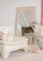 Handmade mosaic mirror in soft pink tones, styled in a serene living room with natural light.