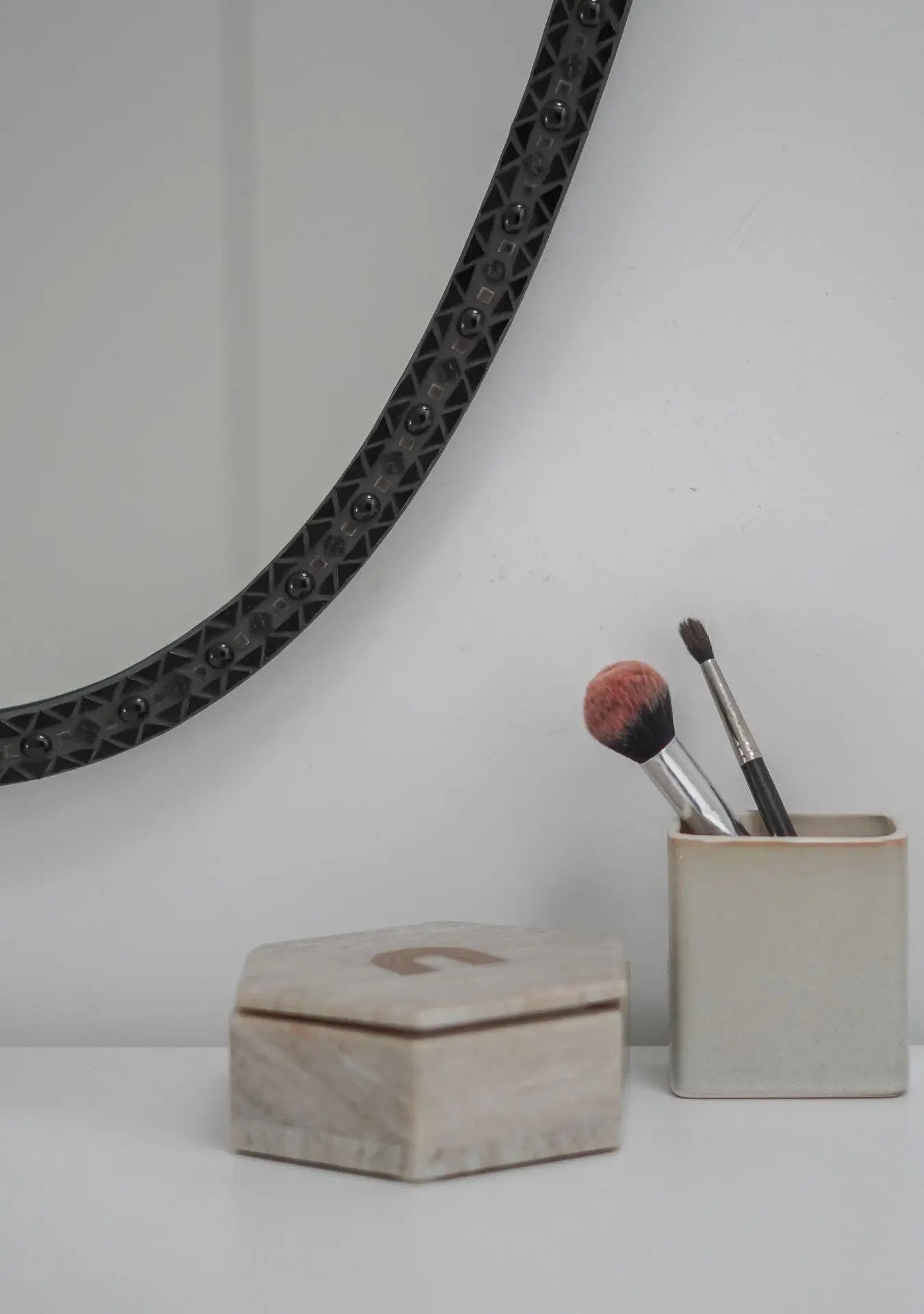 Elegant oval mirror that blends art, craftsmanship and modern design.