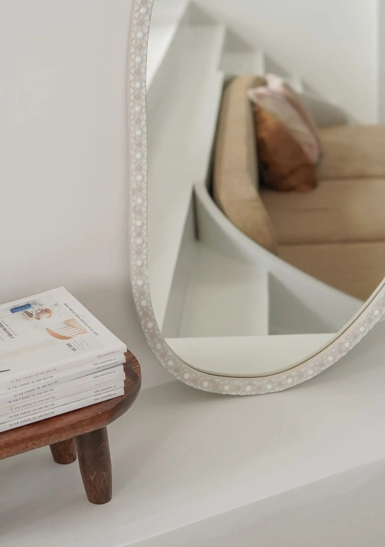 Close-up of mosaic craftsmanship and grout texture on the handmade Pure Reflection mirror ovalie.