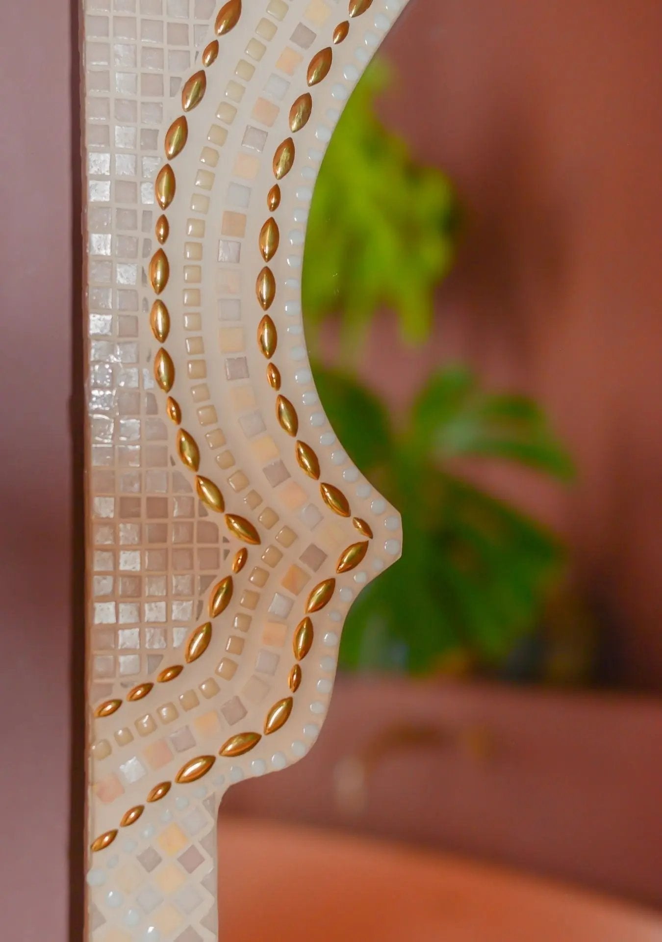 Detail of the mosaic edge and grout texture of the Maraya Pink mirror.